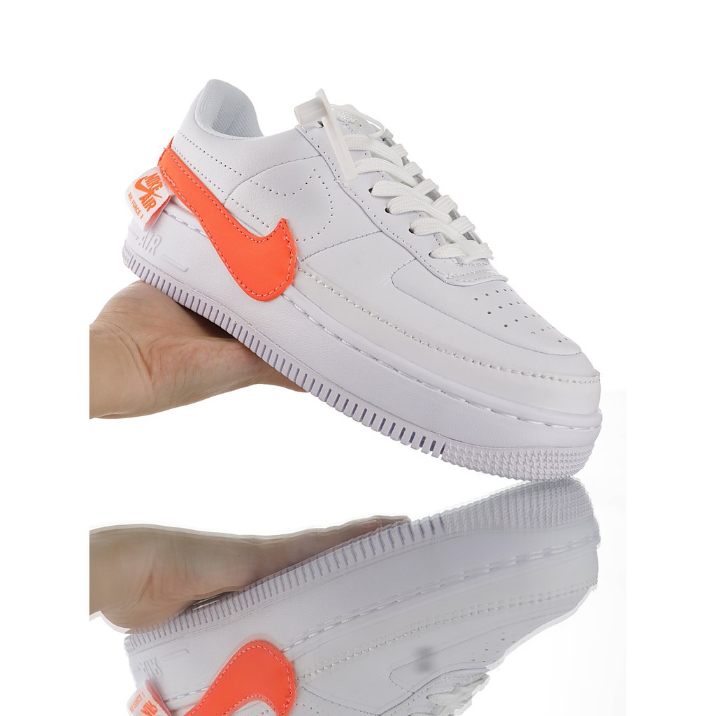 gold and white puma sneakers