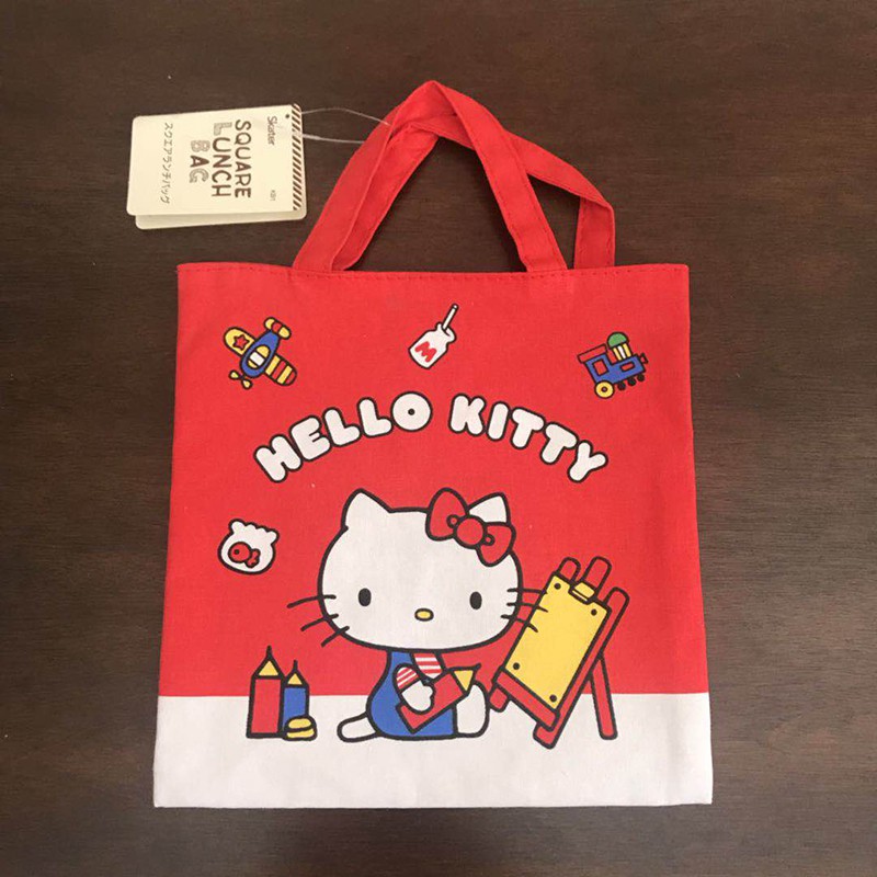 ~熱銷~新款現貨日本hello kitty雙面圖案卡通便當包手拎包多功能尿布掛袋
