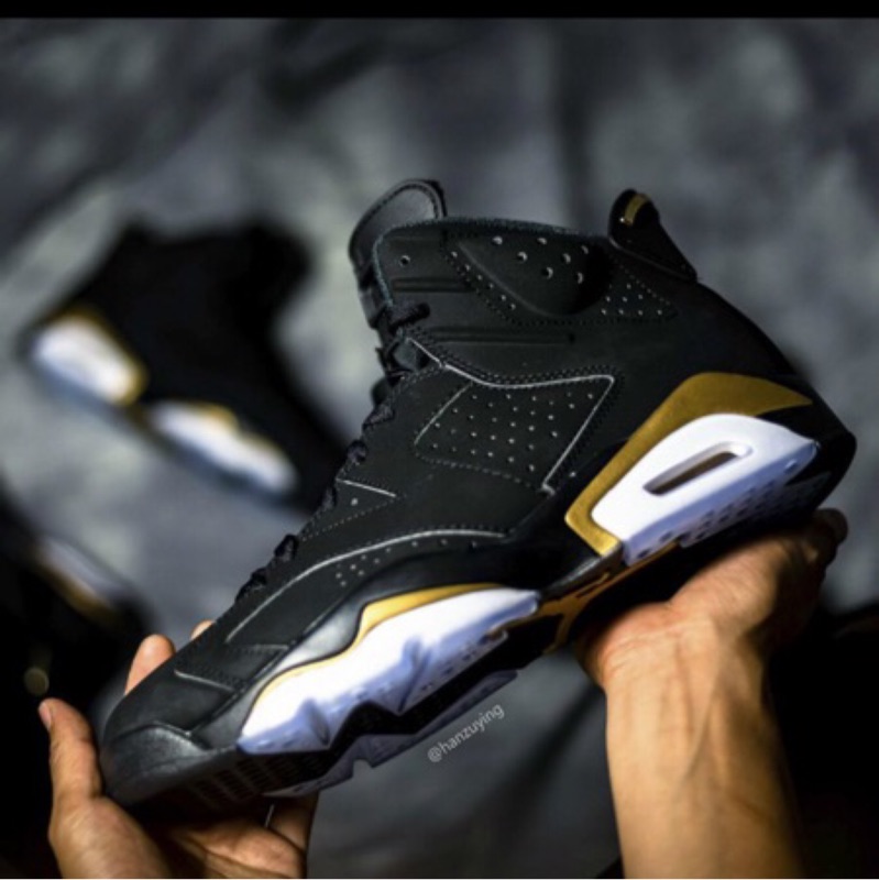 black and gold jordan 6s