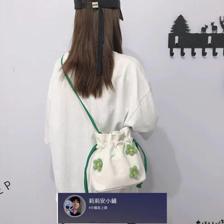 小包包女2021夏天新款韓版百搭斜挎包帆布單肩小清新小花朵水桶包