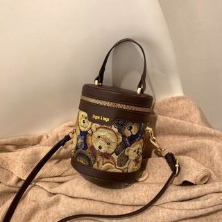 【紫心心】女包小熊塗鴉水桶包包2021新款圓筒包小眾設計手提包側背包斜挎女包小包