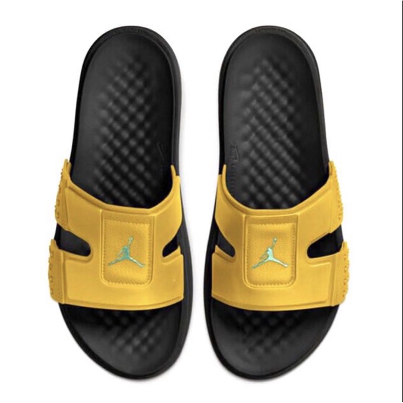 black and yellow nike slides