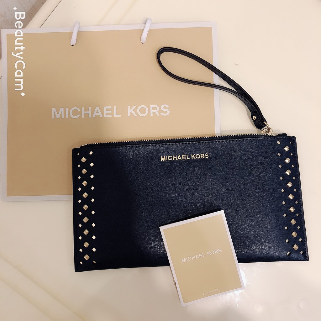 MICHAEL KORS -MK 藍紫色真皮手拿包(附MK商品袋一個)。 美國帶回。 保證真品