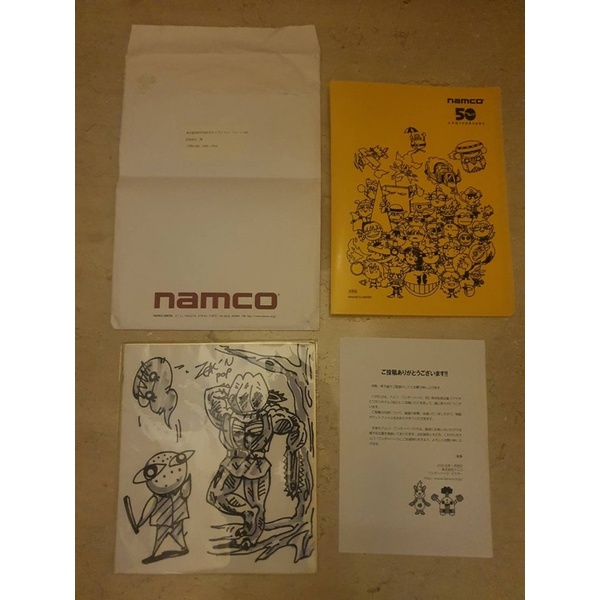 NAMCO 50周年紀念抽獎活動Zakkun Poppu先生創作的親筆畫作 與A4大小的特殊袖珍文件