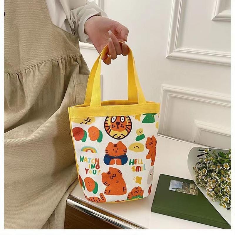 可愛卡通老虎水桶包印花圓筒手提帆布包學生白領上班族便當零食袋Cute cartoon tiger bucket bag