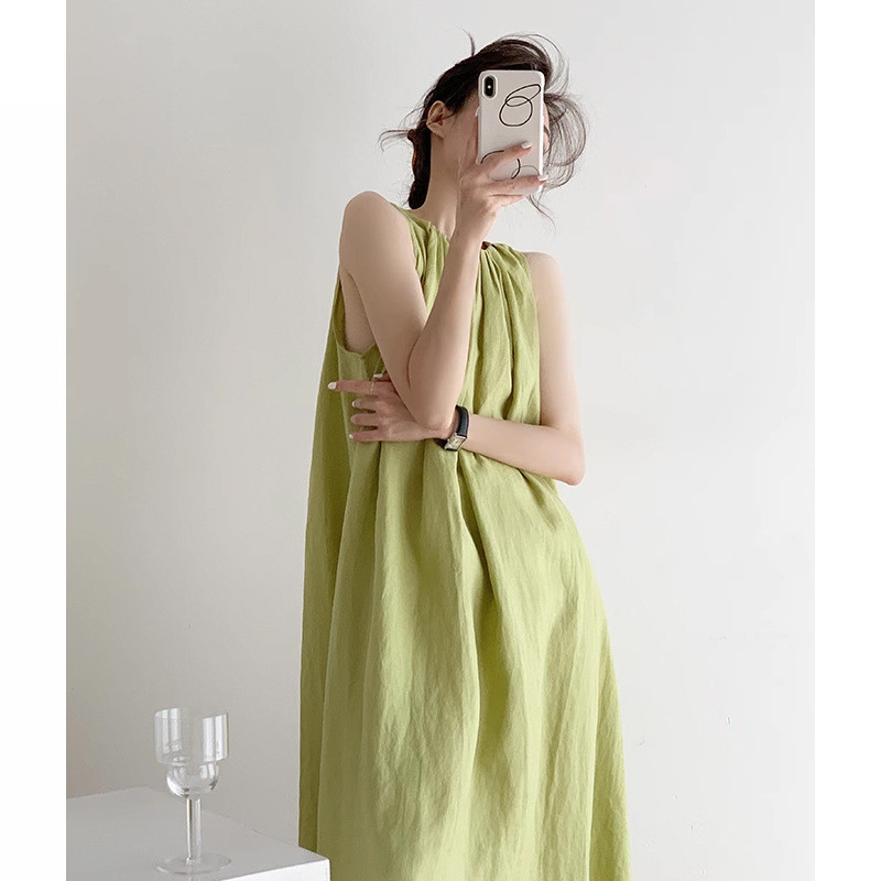酪梨綠色亞麻洋裝女夏顯瘦寬鬆法式吊帶裙大擺背心中長裙度假