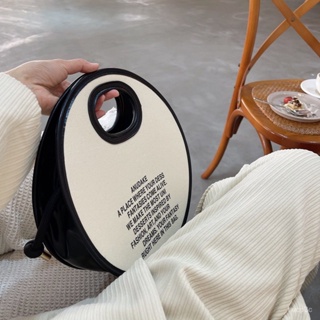 熱賣爆款網紅小白衕款個性小衆設計印字圓形手提包撞色帆佈單肩斜挎包包女 HI2C