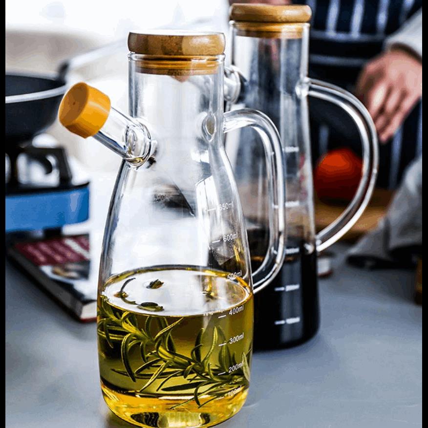 Transparent glass oil bottle with heat resistant handle scal