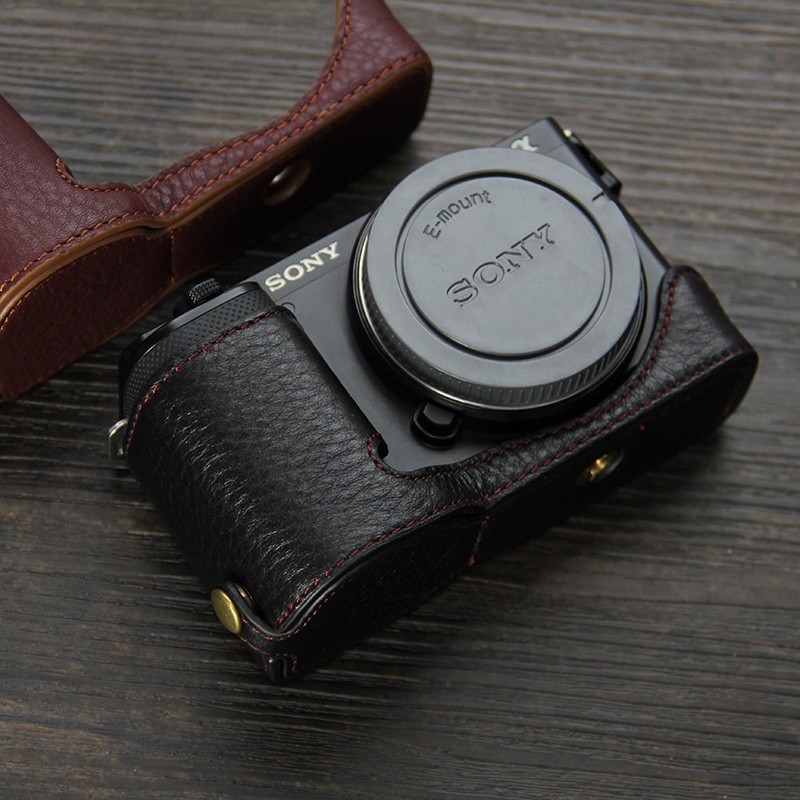 適用索尼zve10相機套 半套底座 真皮手柄 ZV-E10機身保護套相機包
