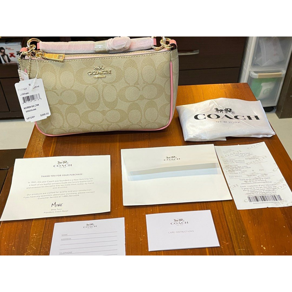 [恩納小天使] 全新正品美國US Coach櫻花粉斜跨肩背兩用彎月包