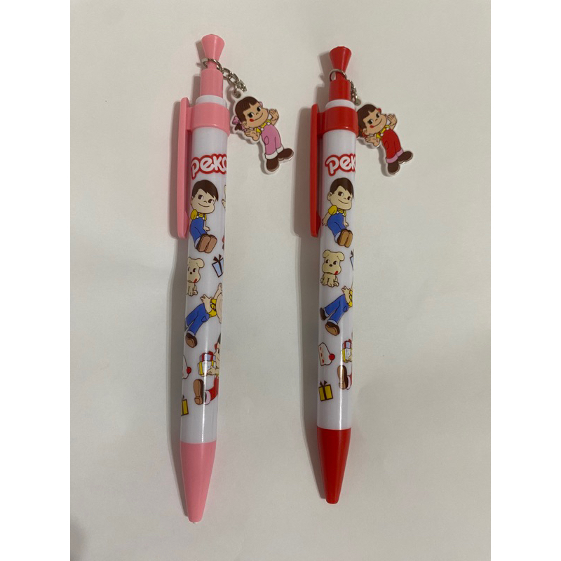 日本不二家牛奶妹吊飾造型原子筆（紅頭）、自動鉛筆（粉紅頭）各1支