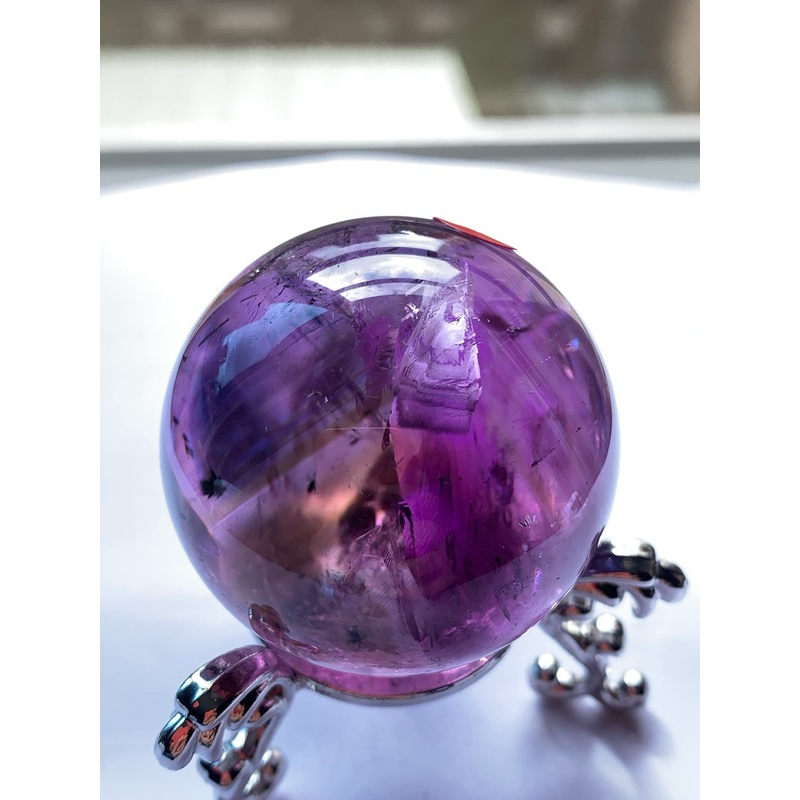紫水晶球紫黃晶球：透體，有薄棉，有海膽花、爆彩、有上帝的指紋、千層塔山