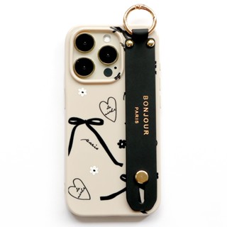 RICHE 品牌直營 iPhone16.15.14.13.12 米膚奶茶亮面軟殼 黑色蝴蝶結手帶手機殼