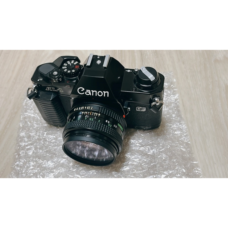 Canon AL-1 本機 附一顆鏡頭 52mm +原始鏡頭蓋 單眼 底片相機(SLR)外觀無損 不確定能否正常運作