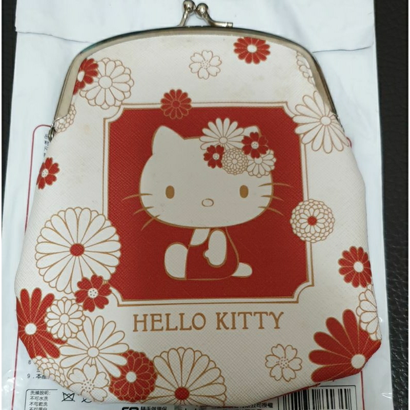 Hello Kitty口金收納包,僅拆封確認款式，買購物袋即贈送，因收藏品出清，難免有痕跡，請三思購買