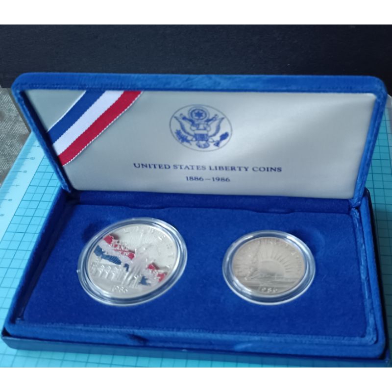 C1476美國1986年自由女神百年精鑄紀念套幣.2枚盒裝含證全(S記.面額1元為銀幣)

