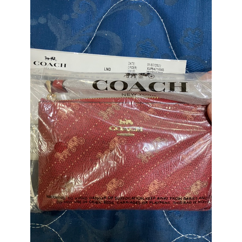 全新COACH 馬車老花小手拿包