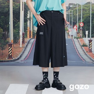 【gozo】不對稱剪接造型七分寬褲(黑色/卡其 M/L) | 女裝 修身 休閒