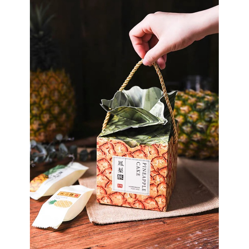 鳳梨造型鳳梨酥提繩包裝盒、鳳梨酥包裝盒。