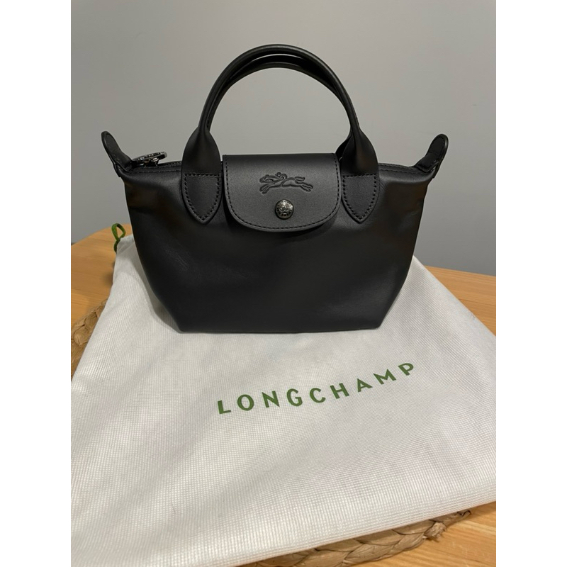 全新LONGCHAMP LE MINI PLIAGE CUIR系列小羊皮短把兩用水餃包(迷你/黑）